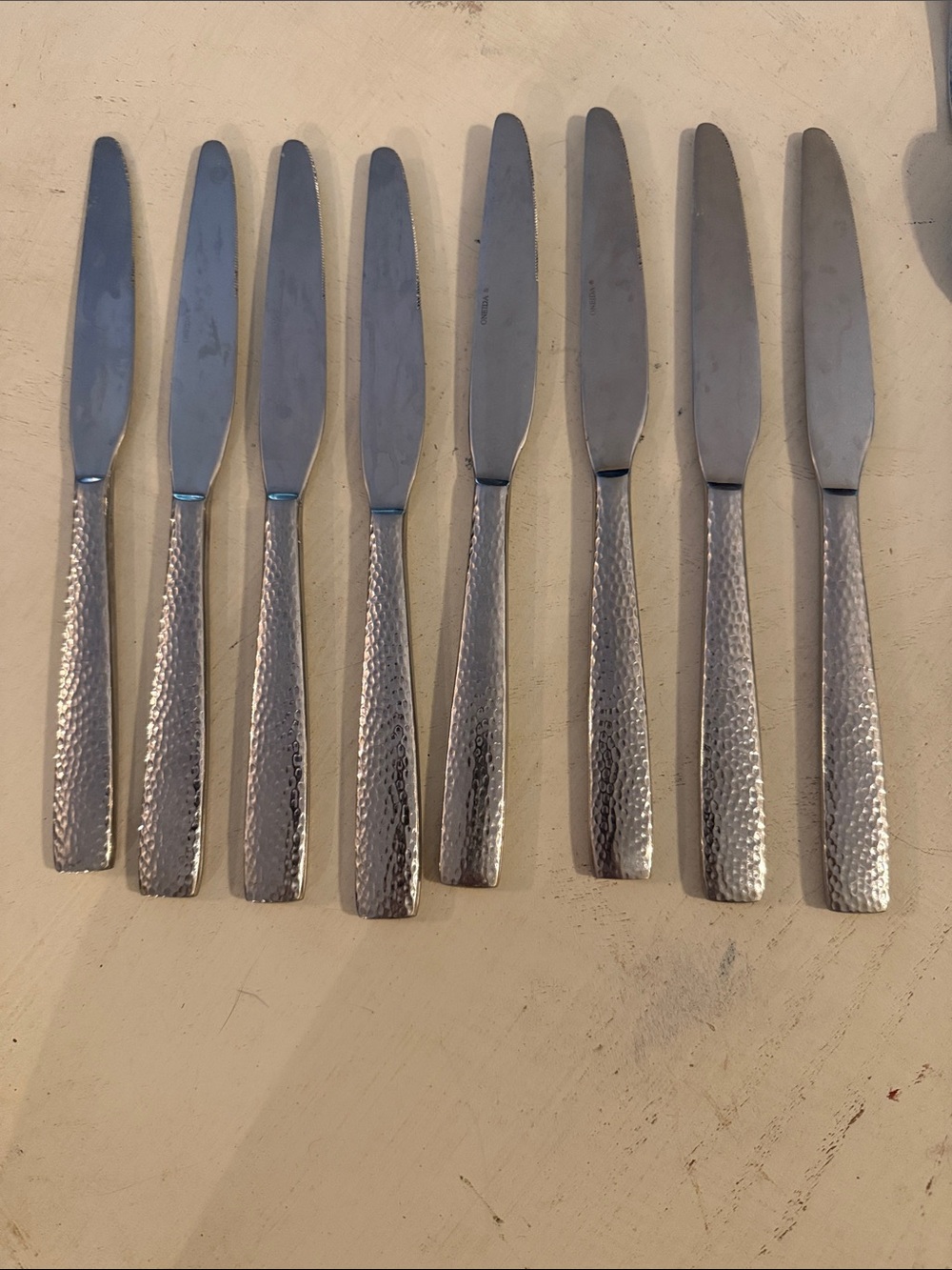 Oneida hammered metal dinner knives